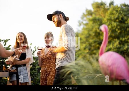 Friends having fun at picnic outdoors Stock Photo