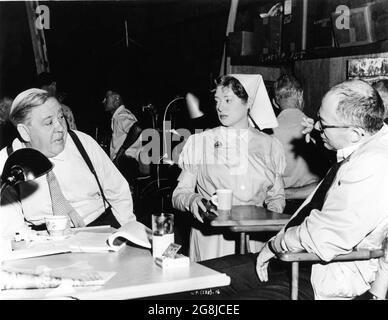 CHARLES LAUGHTON ELSA LANCHESTER and Director BILLY WILDER on set candid during filming of WITNESS FOR THE PROSECUTION 1957 director BILLY WILDER from Agatha Christie's International Stage Success screenplay Billy Wilder and Harry Kurnitz art direction Alexandre Trauner an Arthur Hornblow Production / Edward Small Productions / United Artists Stock Photo