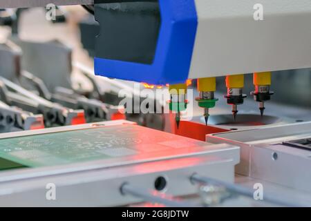 Process of selective soldering components to printed circuit boards at factory Stock Photo