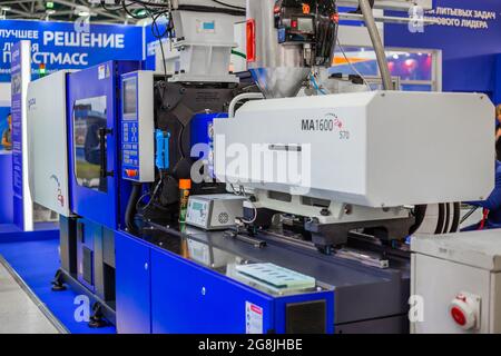 Electric hydraulic injection molding machine at plastic exhibition Stock Photo