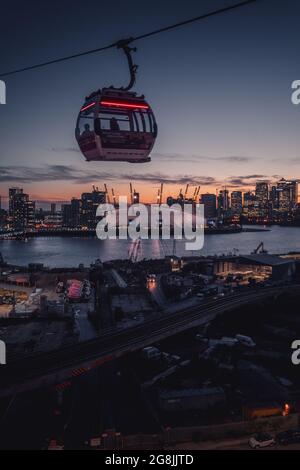 LONDO, UNITED KINGDOM - May 31, 2021: A scenic view of the cable cart  near O2 Area in London, United Kingdom at sunset Stock Photo