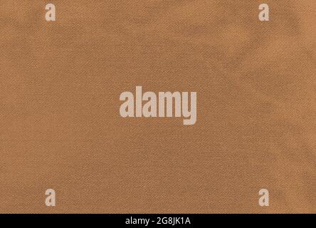 Brown cotton fabric meant as background Stock Photo