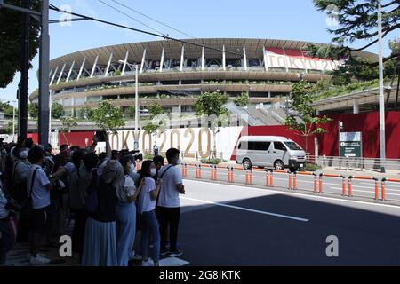 Fans of the aerobatic demonstration team Blue Impulse, currently 11 Squadron 4th Air Wing Team, wait to watch a rehersal for the 2020 Tokyo Olympic opening ceremony outside the National Stadium in Tokyo, Japan on July 21, 2021. Credit: Michael Steinebach/AFLO/Alamy Live News Stock Photo