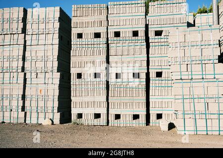 Pile of concrete cement cinder blocks at the construction site. Stock Photo
