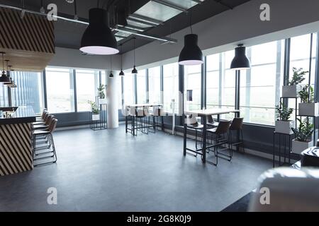 Interior of empty cafeteria with tables in modern office Stock Photo