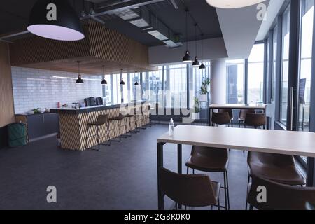 Interior of empty cafeteria with tables in modern office Stock Photo