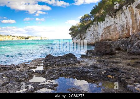 On the rocks of popular Cala Llombards, balearic island of Majorca or Mallorca, in winter. View in direction of Cala Santanyi. Stock Photo