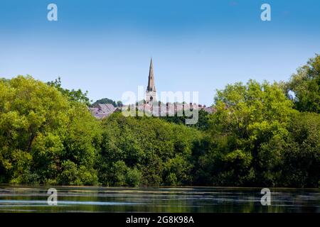 St Marys The Virgin church, Higham Ferrers, near Rushden, Northamptonshire, UK, viewed from Rushden lakes Stock Photo