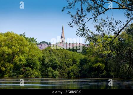 St Marys The Virgin church, Higham Ferrers, near Rushden, Northamptonshire, UK, viewed from Rushden lakes Stock Photo