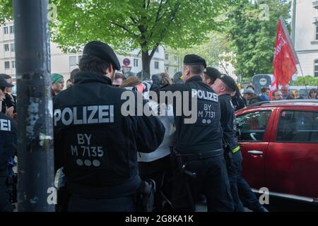 Muncih, Germany. 01st May, 2019. Police pushed the counter protetors partly brutally away. On 1.5.2019 a few hundreds protested against a small group of AfD supporters in Munich. The AfD held a rally at the St. Paul's Church in Munich after a man who was mentally confused man disturbed the easter mess in the church. (Photo by Alexander Pohl/Sipa USA) Credit: Sipa USA/Alamy Live News Stock Photo