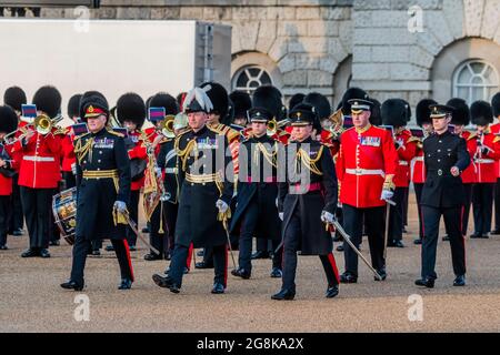 London, UK. 20th July, 2021. Major General CJ Ghika CBE, Commander of the Houeshold Division (plumed hat), and Lieutenant General IJ Cave, CB, come out to take the salute - Members of the bands of the Grenadier, Coldstream, Scots, Irish and Welsh Guards and representatives from the 1st Battalion Grenadier Corps of Drums perform The Sword & The Crown. Credit: Guy Bell/Alamy Live News Stock Photo