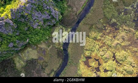 Van Long Natural Reserve in Ninh Binh, Vietnam from aerial view Stock Photo