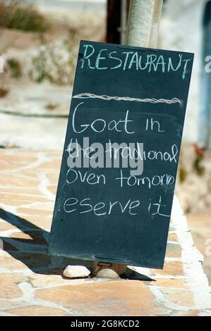 Anafi island Greece Taverna menu on a blackboard Simple, authentic nutritious local food available for lunch Vertical shot with blurred background for Stock Photo
