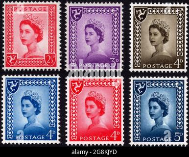 Set of Isle of Man regional issue stamps. The red twopence halfpenny and a lilac threepence were issued on 18 August 1958 and the others, of the same design but different colour and denomination between then and 1969 and is use until 1973. Stock Photo