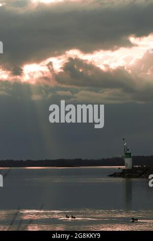 Sunset over a lighthouse in the Ottawa river Stock Photo