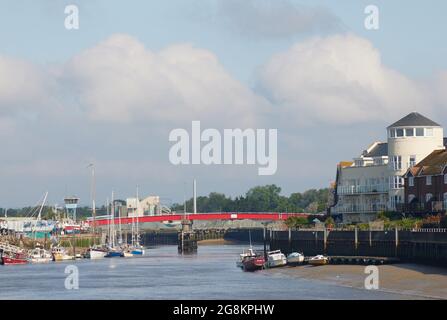 Red foot and bicycle bridge seen in Littlehampton, West Sussex, England, UK. Stock Photo