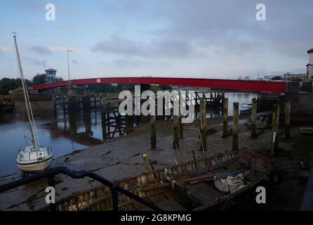 Red foot and bicycle bridge seen in Littlehampton, West Sussex, England, UK. Stock Photo