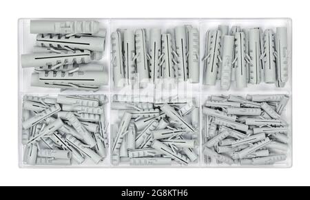 Set of wall plugs in a clear plastic box. Assorted gray anchors or rawlplugs in a container. Plastic insert, allow a screw to be fitted into a wall. Stock Photo