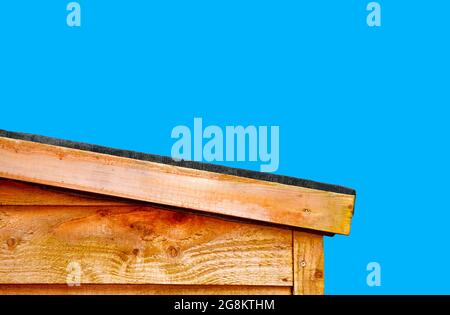 A slopping wooden shed roof to let the rain water run off the roof, roofing felt is use to prevent the rain water entering the shed and protect the wo Stock Photo