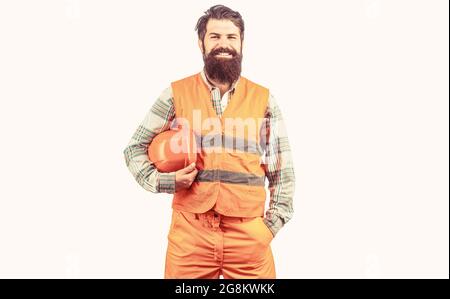 Worker in construction uniform. Man builders, industry. Builder in hard hat, foreman or repairman in the helmet. Bearded man worker in building helmet Stock Photo