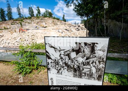 21 July 2021, Bavaria, Flossenbürg: An information board stands in front of the Flossenbürg concentration camp quarry. The Free State firmly rejects any further use of the quarry beyond the current lease period. Photo: Armin Weigel/dpa Stock Photo