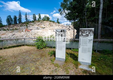 21 July 2021, Bavaria, Flossenbürg: Information boards stands in front of the Flossenbürg concentration camp quarry. The Free State firmly rejects any further use of the quarry beyond the current lease period. Photo: Armin Weigel/dpa Stock Photo