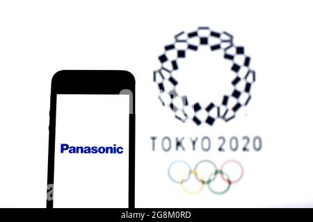 Barcelona, Catalonia, Spain. 20th July, 2021. In this photo illustration a Panasonic logo seen displayed on a smartphone with a Tokyo 2020 Olympic Games logo in the background. (Credit Image: © Thiago Prudencio/DAX via ZUMA Press Wire) Stock Photo