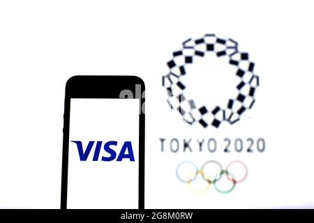 Barcelona, Catalonia, Spain. 20th July, 2021. In this photo illustration a Visa Inc. logo seen displayed on a smartphone with a Tokyo 2020 Olympic Games logo in the background. (Credit Image: © Thiago Prudencio/DAX via ZUMA Press Wire) Stock Photo