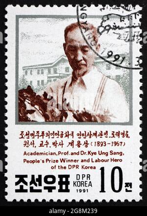 NORTH KOREA - CIRCA 1991: a stamp printed in North Korea shows Dr. Kye Ung, silkworm researcher, circa 1991 Stock Photo