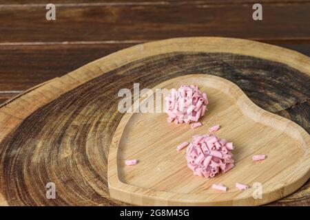 Closeup of two red fruit brigadiers. Focus made on the upper brigadier. Stock Photo