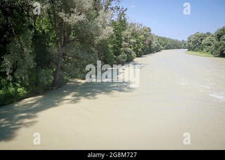 Ismaning, Bavaria, Germany - High water of  the Isar river from the B 471 bridge few Kilometers from Munich. The river banks are submerged and the tre Stock Photo