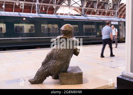 Rear  view of Bronze Paddington bear seen on platform at railway station Paddington London England Stock Photo