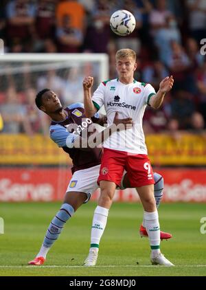 Aston Villa's Ezri Konsa (left) and Walsall's Kieran Phillips battle for the ball during the pre-season friendly match at Banks's Stadium, Walsall. Picture date: Wednesday July 21, 2021. Stock Photo