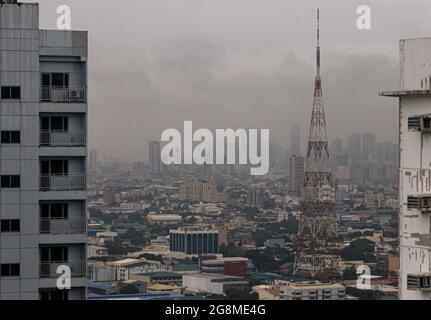 Quezon City, Philippines. 21st July 2021. Buildings and houses in Quezon City were drenched by the southwest monsoon enhanced by Typhoon Fabian. Stock Photo