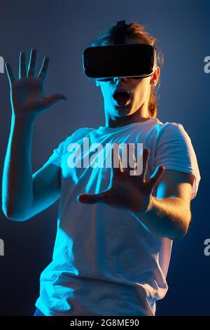 Young man using virtual reality headset. VR gadgets Stock Photo