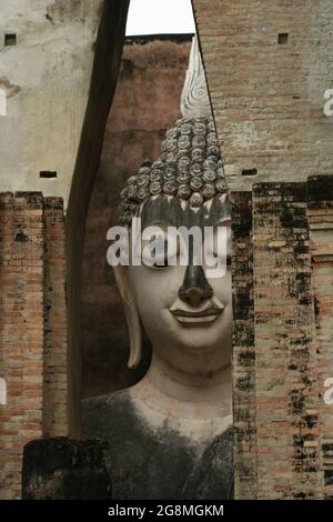 Large seated Buddha statue in Wat Si Chum, Sukhothai Historical Park, Thailand