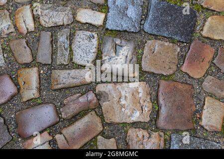 Paving stone texture. Masonry background. Paved road or stone pavement. Top view. Cobbled surface Stock Photo