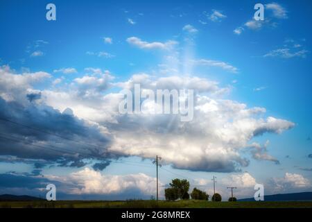 Panorama view on a moody cloudscape in the evening Stock Photo