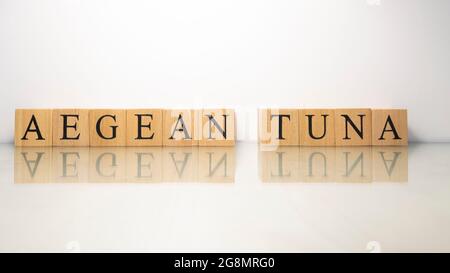 The phrase Aegean Danube was created from wooden letter cubes. Seafood and food. close up. Stock Photo