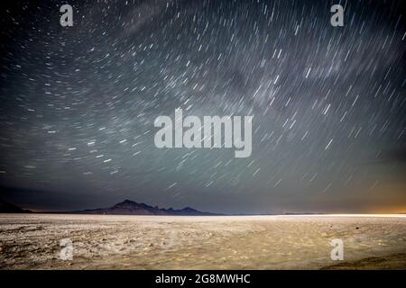 large star trails in the night sky Stock Photo