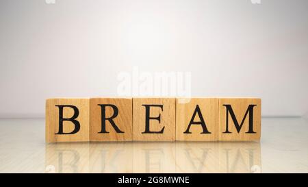 The name Bream was created from wooden letter cubes. Seafood and food. close up. Stock Photo