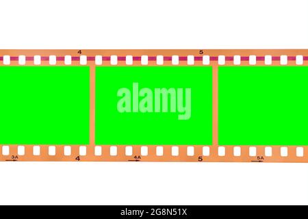 Vintage film strip isolated on white with chroma green screen frames. Stock Photo