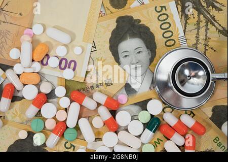 Korea's 50,000 won notes and various types of medicines. Stock Photo