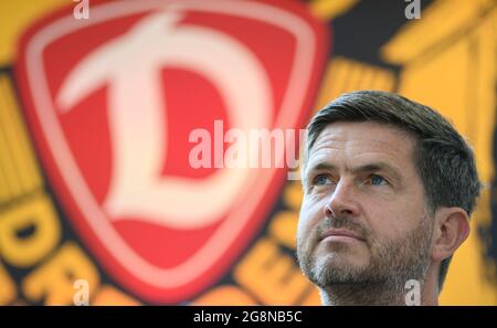 Dresden, Germany. 21st July, 2021. Football: 2nd Bundesliga, SG Dynamo Dresden members' meeting, at Rudolf Harbig Stadium. Dynamo's sports director Ralf Becker sits on the podium. Credit: Robert Michael/dpa-Zentralbild/dpa - IMPORTANT NOTE: In accordance with the regulations of the DFL Deutsche Fußball Liga and/or the DFB Deutscher Fußball-Bund, it is prohibited to use or have used photographs taken in the stadium and/or of the match in the form of sequence pictures and/or video-like photo series./dpa/Alamy Live News Stock Photo