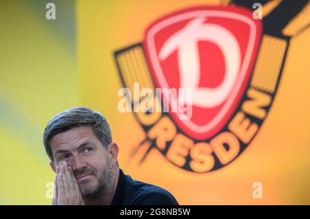 Dresden, Germany. 21st July, 2021. Football: 2nd Bundesliga, SG Dynamo Dresden members' meeting, at Rudolf Harbig Stadium. Dynamo's sports director Ralf Becker sits on the podium. Credit: Robert Michael/dpa-Zentralbild/dpa - IMPORTANT NOTE: In accordance with the regulations of the DFL Deutsche Fußball Liga and/or the DFB Deutscher Fußball-Bund, it is prohibited to use or have used photographs taken in the stadium and/or of the match in the form of sequence pictures and/or video-like photo series./dpa/Alamy Live News Stock Photo