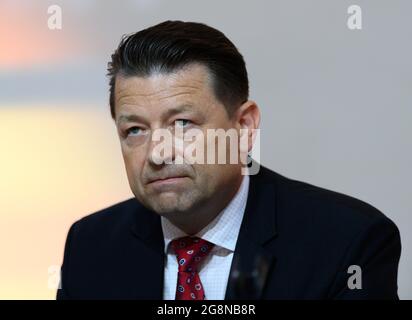 Dresden, Germany. 21st July, 2021. Football: 2nd Bundesliga, SG Dynamo Dresden members' meeting, at Rudolf Harbig Stadium. Re-elected Dynamo president Holger Scholze sits on the podium. Credit: Robert Michael/dpa-Zentralbild/dpa - IMPORTANT NOTE: In accordance with the regulations of the DFL Deutsche Fußball Liga and/or the DFB Deutscher Fußball-Bund, it is prohibited to use or have used photographs taken in the stadium and/or of the match in the form of sequence pictures and/or video-like photo series./dpa/Alamy Live News Stock Photo