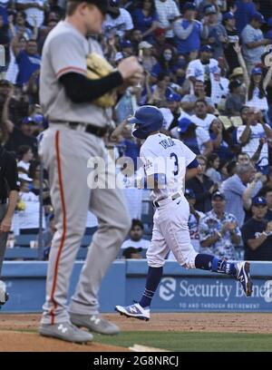 Los Angeles, United States. 22nd July, 2021. Los Angeles Dodgers' Chris Taylor rounds the bases after hitting a lead-off solo home run off San Francisco Giants starting pitcher Logan Webb (L) during the first inning at Dodger Stadium in Los Angeles on Tuesday, July 20, 2021. The Giants defeated the Dodgers 4-2. Photo by Jim Ruymen/UPI Credit: UPI/Alamy Live News Stock Photo