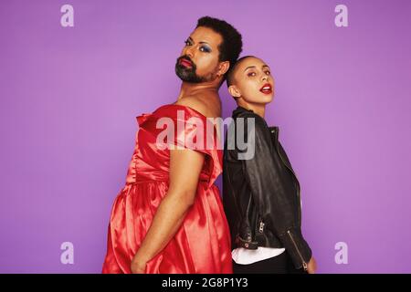 Friends breaking the gender stereotypes by wearing the opposite genders clothing. Stock Photo