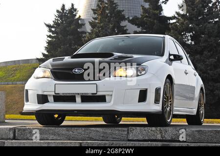 Kiev Ukraine March 25 15 Subaru Impreza Wrx Sti Girl In Colored Sneakers And In White Trousers Girl On Car Background Car And Girl Stock Photo Alamy