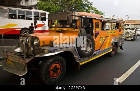 Jeepney traffic in central Manila, Philippines, Southeast Asia, Asia Stock Photo